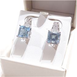 Lady's Sterling Silver Aqua Marine & Diamond Accented Earrings.  Post style earrings with butterfly 