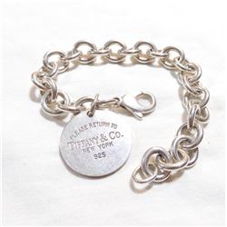 Lady's Sterling Silver Bracelet Signed 'TIFFANY'.  Measures 7 1/4" in length.