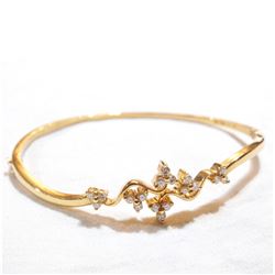 Lady's 18K Yellow Gold Diamond Hinged Cuff Bracelet. Total weight of 11.09 grams.