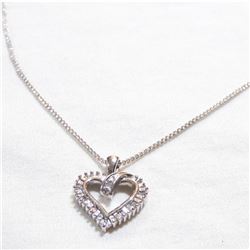 Lady's 10K White Gold Diamond Heart Pendant on 14K White gold 18"Chain.  Total weight of 3.88 grams.