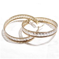 Lady's 10K Yellow & White Gold Aztec Design Hoop Earrings. Total weight of 7.36 grams.