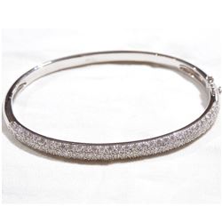 Lady's 18K White Gold Pave' Diamond Hinged Cuff Bracelet.  Bracelet measured 2 1/4" in diameter with