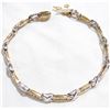 Image 2 : Lady's 14K Yellow & White Gold Channel Set Diamond Bracelet. Measures 7" in length with safety catch