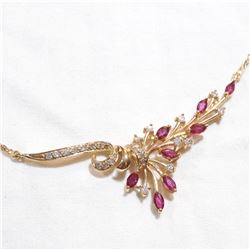 Lady's 14K Yellow gold Diamond and Ruby Necklace. Measures approx.. 16.5" in length with a total wei