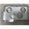 Image 2 : SET OF 4 1965 CANADIAN SILVER DOLLARS. INCLUDES TYPES 1, 2, 3 & 4. ALL COINS UNC. HOUSED IN CUSTOM H