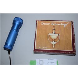 Flashlight and Brass Door Knocker