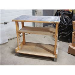 WOODEN WORK TABLE 40.5 BY 21.5 BY 37 HAS CASTERS