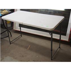 FOLDING TABLE  23.5 BY 47.5 LEGS EXTEND