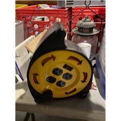 Extension cord on retractable reel