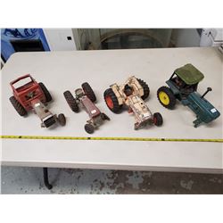 4 antique toy tractors, 2 Massey Ferguson, 1 John Deere, 1 Case