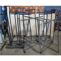 Mixed lot of clothes display racks.   As shown.   Some casters missing.   No ring for silver racks.