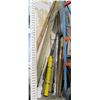Image 1 : Mixed lot corner of warehouse.   2x3 pieces of wood, 2x12 wood, large roll of carpet, large roll of 