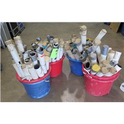 Four buckets of PVC Stake covers.   Some have cuts to allow tie downs to fit on the cover.