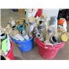 Image 4 : Four buckets of PVC Stake covers.   Some have cuts to allow tie downs to fit on the cover.