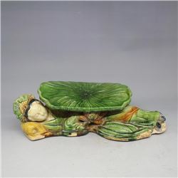 A GREEN PILLOW STATUE MING DYNASTY.