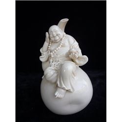 A WHITE PORCELAIN BUDDHA FIGURE MING DYNASTY.