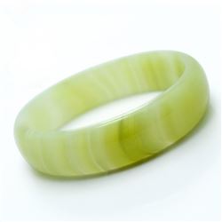 A NATURAL WHITE HETIAN JADE BANGLE.