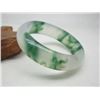 Image 1 : A NATURAL BURMA WAVE JADE BANGLE.
