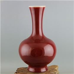 A OX-BLOOD BOTTLE VASE QING DYNASTY.