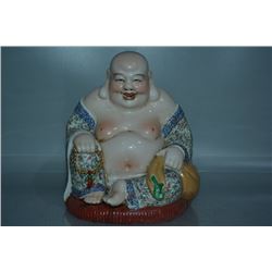 A PORCELAIN ENAMEL BUDDHA FIGURE QING DYNASTY 17TH/C.