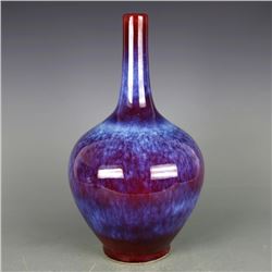 A RED GLAZED BOTTLE VASE QING DYNASTY.