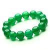Image 1 : A NATURAL GREEN JADE BEAD BRACELET.
