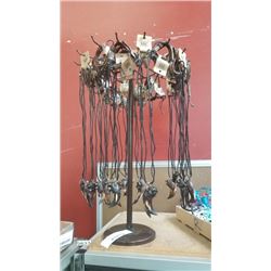 LEATHER NECKLACES ON SPINNING DISPLAY RACK