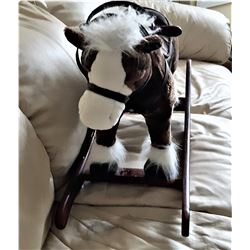 27)  BROWN AND WHITE PLUSH ROCKING