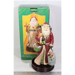 MUSICAL SANTA WITH RED CAPE ON WOOD BASE
