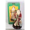 Image 1 : MUSICAL SANTA WITH RED CAPE ON WOOD BASE