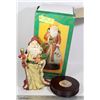 Image 1 : MUSICAL SANTA WITH GREEN COAT ON WOOD BASE
