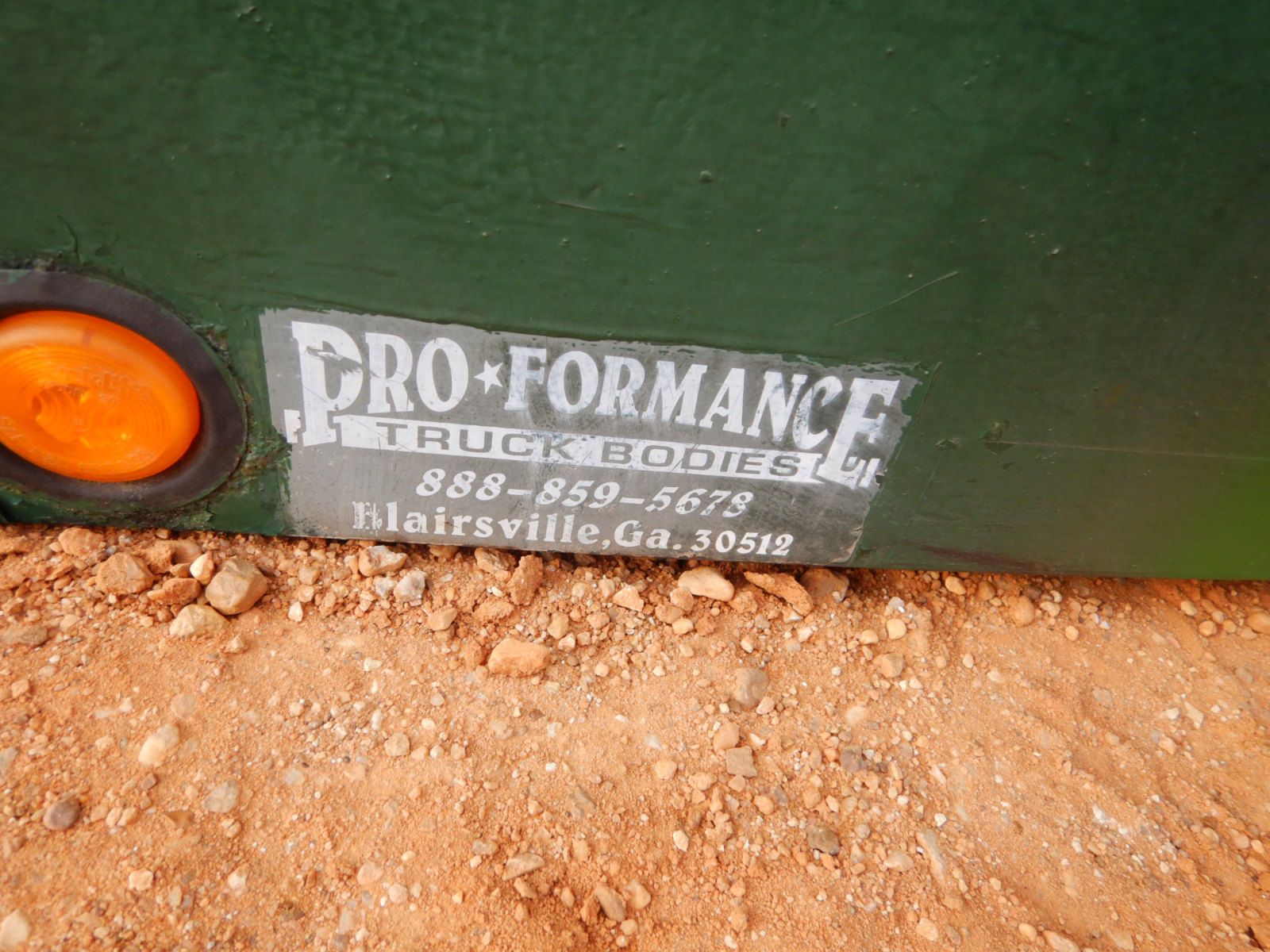 16' x 8' flatbed w/4' dovetail, fold down ramp, storage shelve, side rail