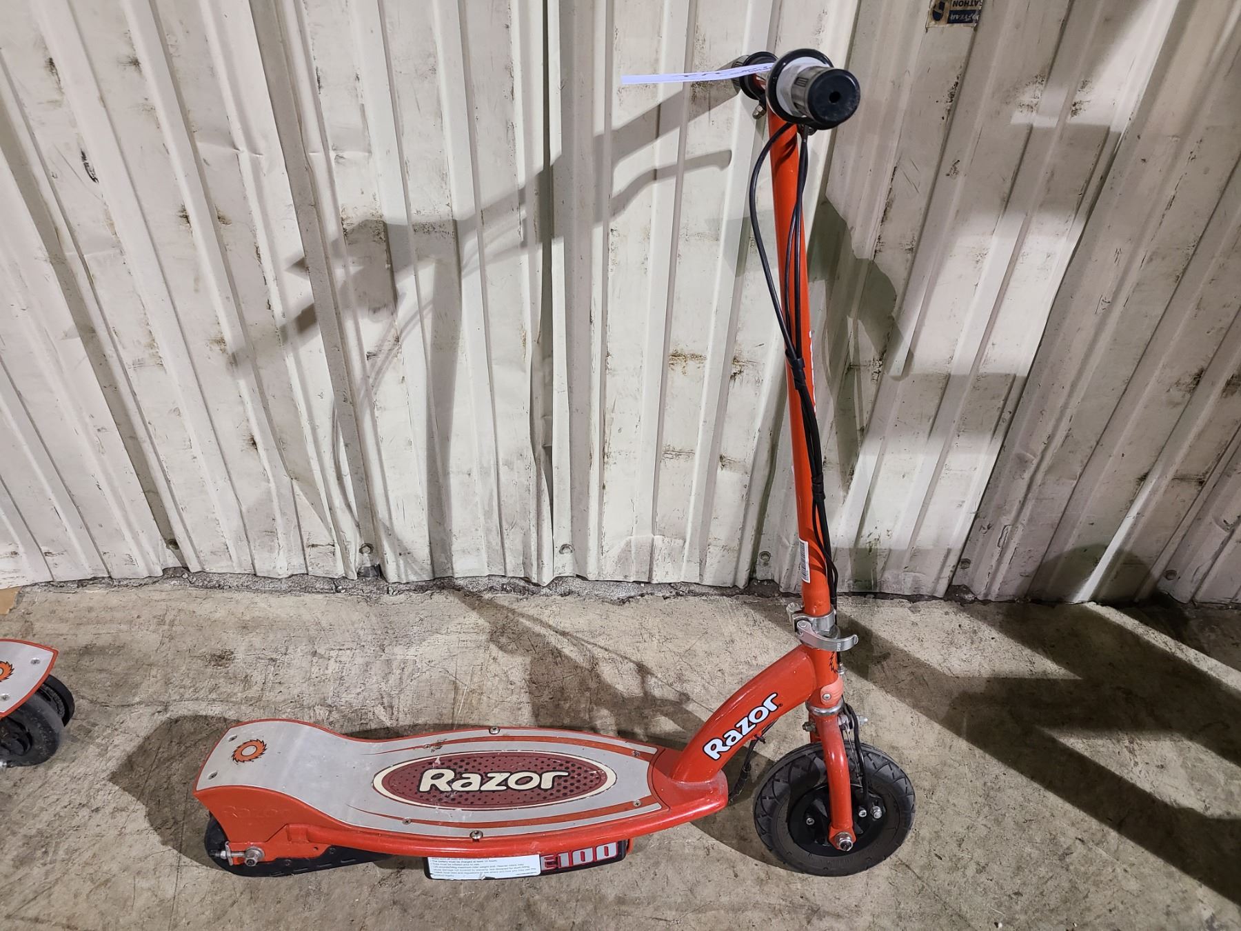 2 RED RAZOR ELECTRIC SCOOTERS AND 1 CHARGER - Able Auctions