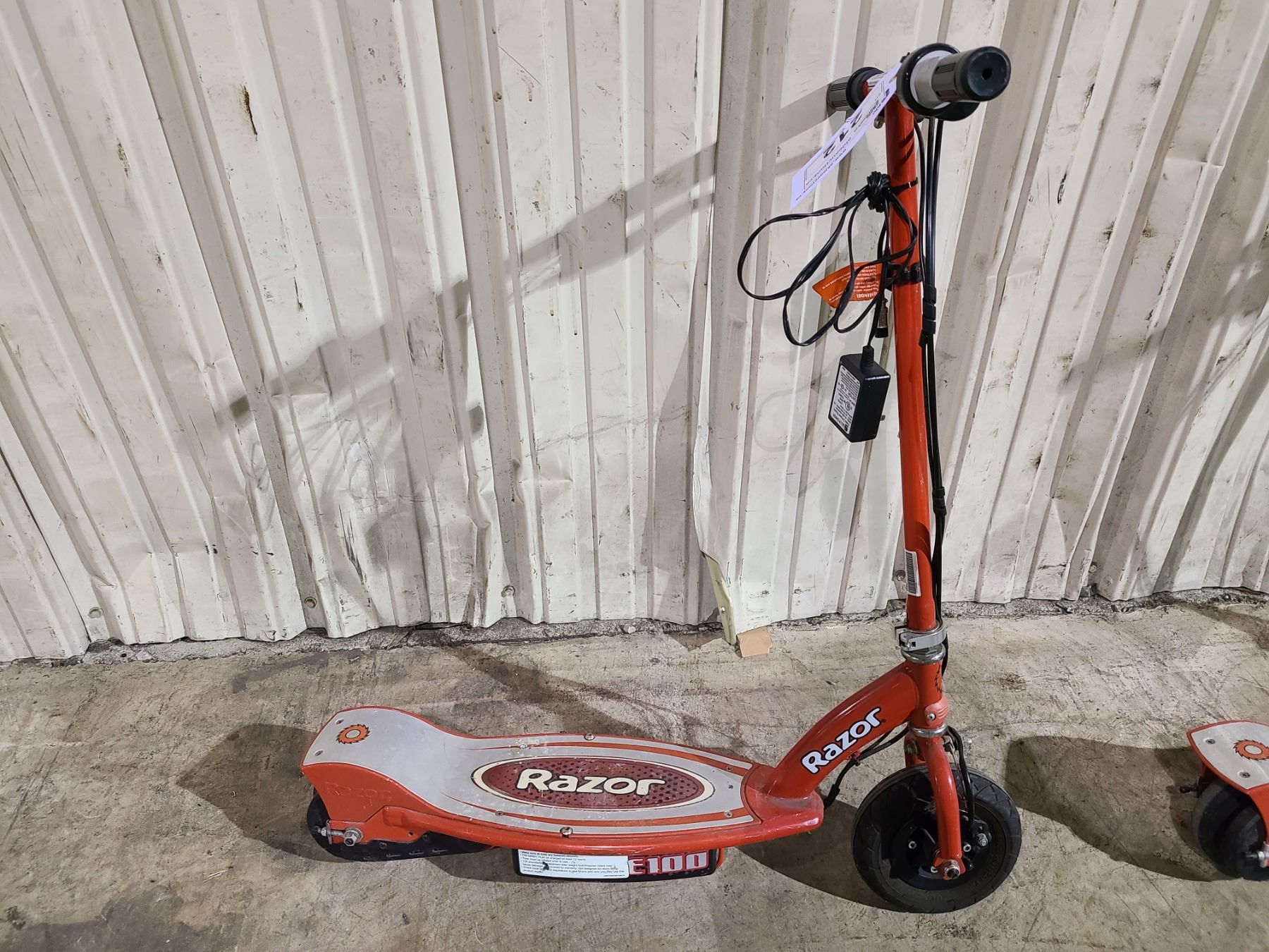 2 RED RAZOR ELECTRIC SCOOTERS AND 1 CHARGER - Able Auctions