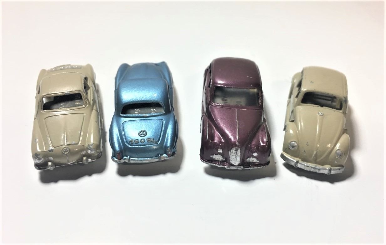 Four Small Toy Cars Made in Germany