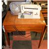 Image 1 : SINGER SEWING MACHINE IN A CABINET. 28"X18"X30"
