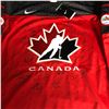 Image 2 : 2020 TEAM CANADA SIGNED IIHF NATIONAL JUNIOR TEAM REPLICA JERSEY (MISSING TWO SIGNATURES)