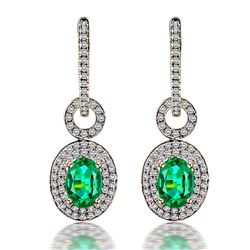 A 14KT YELLOW GOLD AND EMERALD & DIAMONDS EARRING.