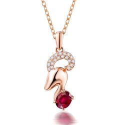 A 18KT ROSE GOLD AND RUBY & DIAMONDS PENDANT.