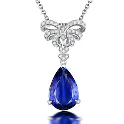 A 18KT WHITE GOLD AND TANZANITE & DIAMONDS PENDANT.
