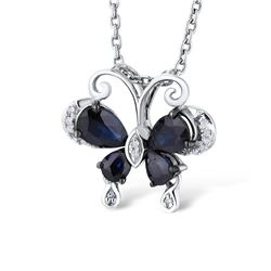 A 14KT WHITE GOLD AND SAPPHIRE & DIAMONDS PENDANT.