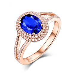 A 14KT ROSE GOLD AND TANZANITE & DIAMONDS RING.