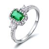 Image 1 : A 18KT WHITE GOLD AND EMERALD & DIAMONDS RING.