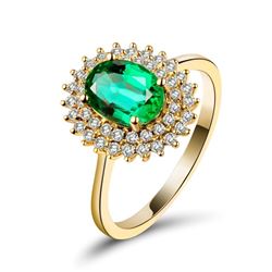 A 18KT YELLOW GOLD AND EMERALD & DIAMONDS RING.