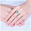 Image 6 : A 14KT YELLOW GOLD AND EMERALD RING.