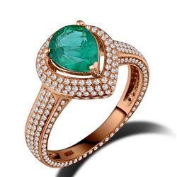 A 18KT ROSE GOLD AND EMERALD & DIAMONDS RING.