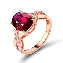 A 18KT ROSE GOLD AND TOURMALINE & DIAMONDS RING.