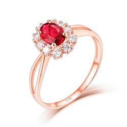 A 14KT ROSE GOLD AND RUBY & DIAMONDS RING.