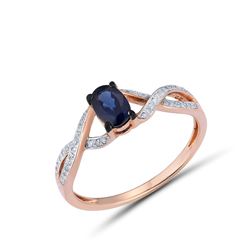 A 14KT ROSE GOLD AND SAPPHIRE & DIAMONDS RING.