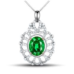 A 14KT TWO-TONE GOLD AND EMERALD & DIAMONDS PENDANT.